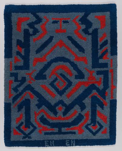 Elisabeth Nielsen-Georgi, Teppich mit blau-rotem Ornament, 1958, nach einem Entwurf von Erich Heckel, Wollzwirn, Smyrna-Arbeit (aufgeschnittener Plüsch-Steppstich) auf Stramin, Brücke-Museum, © VG Bild-Kunst, Bonn 2026
