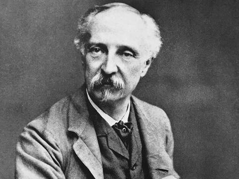 Edward W. Godwin mit Skizzenbuch in der Hand um 1880