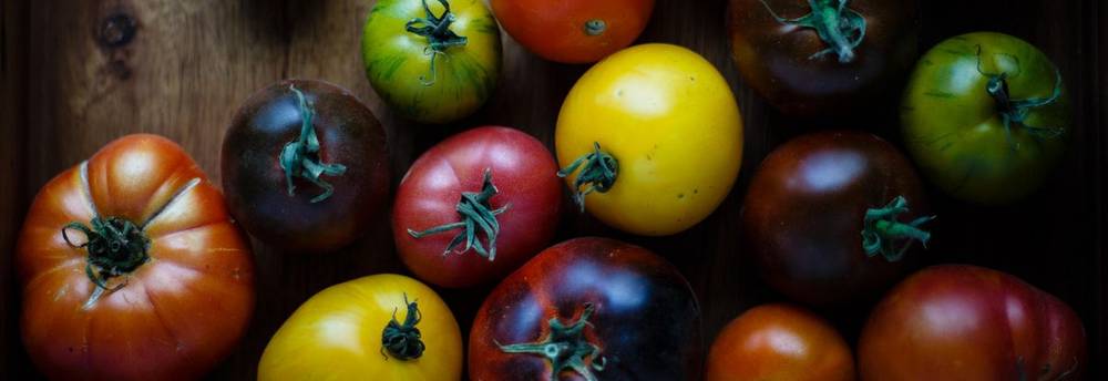 Heirloom Tomatoes on Wooden Board