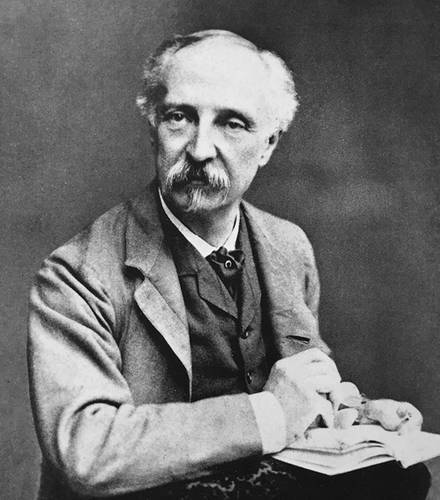 Edward W. Godwin mit Skizzenbuch in der Hand um 1880